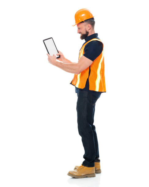 istock Working class standing wearing shirt and holding hammer and using digital tablet 1221299533