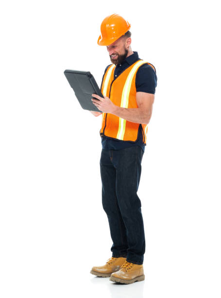 istock Building contractor standing wearing shirt and holding paperwork 1221299632