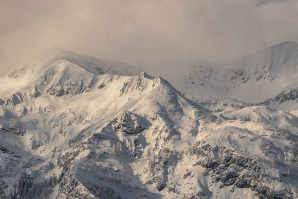 istock Bohinj mountains covered in snow on cloudy day 1221303603