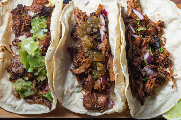 istock Carnitas tacos with red onion and raw green salsa 1221304345