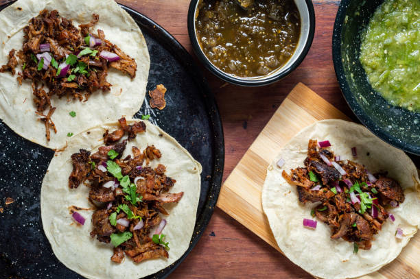 istock Carnitas tacos with red onion and raw green salsa 1221304365