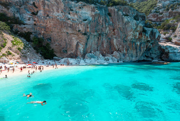 Cala Gonone, Sardinia, Italy, Cala Mariolu - Beach with unidentifiable people stock photo