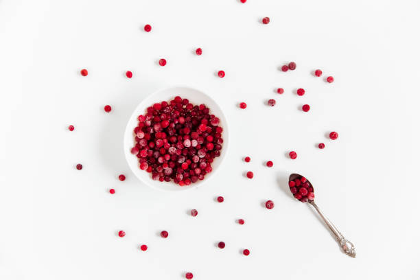 istock Frozen cranberries in the white plate.Fresh red berry cranberries.White background.Top view. 1221304484