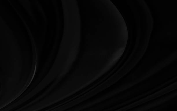 istock Black gray satin dark fabric texture luxurious shiny that is abstract silk cloth background with patterns soft waves blur beautiful. 1221305279
