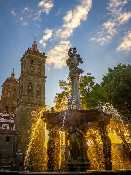Zocalo Park Plaza San Miguel Arcangel Fountain Cathedral Sunset Puebla Mexico. Cathedral built in 15 and 1600s, Fountain in 1777