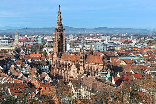 Freiburg im Breisgau, Germany. View over Freiburg Minster from slope of Schlossberg Hill. The cathedral was founded around 1200 and completed in 1330. It has remained largely intact in World War II.