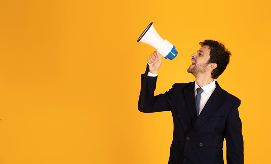 businessman shouting on the megaphone.