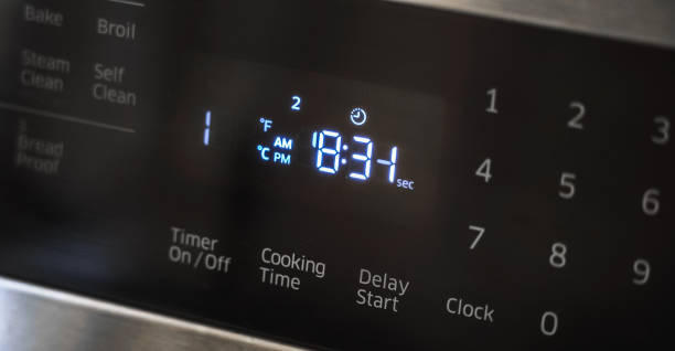 istock Close up of oven display flickering, control panel blinking. Stove electricity problem 1221306218
