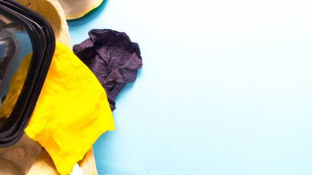 istock Garbage from plastic, paper, iron, cellophane on a blue background. 1221308369