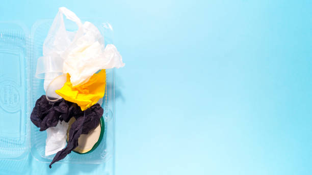 istock Garbage from plastic, paper, iron, cellophane on a blue background. 1221308380