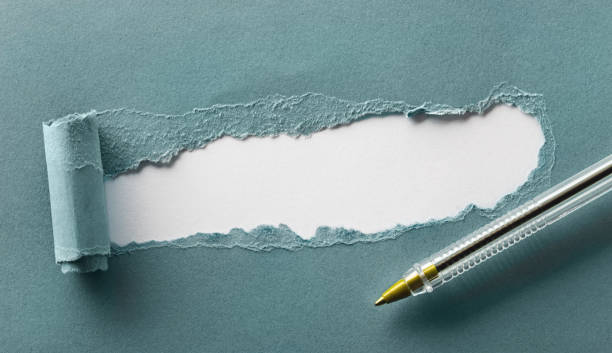 istock Torn blue paper with space for your text close up 1221309446