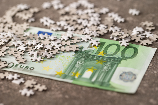 Euro banknote with jigsaw puzzle