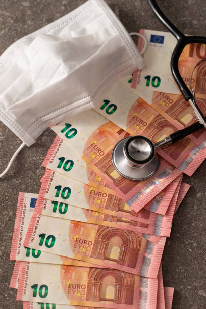 istock Euro banknote with face mask and stethoscope 1221310149