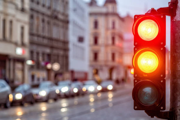 istock A city crossing with a semaphore. Red and orange light in semaphore 1221310260