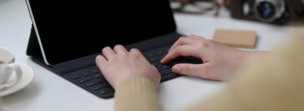 istock Cropped shot of female freelancer working on digital tablet on white table 1221310465