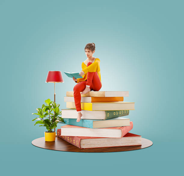 istock Young pretty female reads sitting on a stack of books. 1221310510