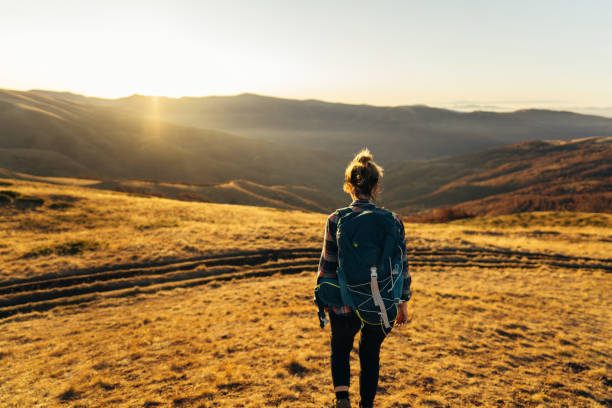 istock Woman hiking down the hill 1221311561