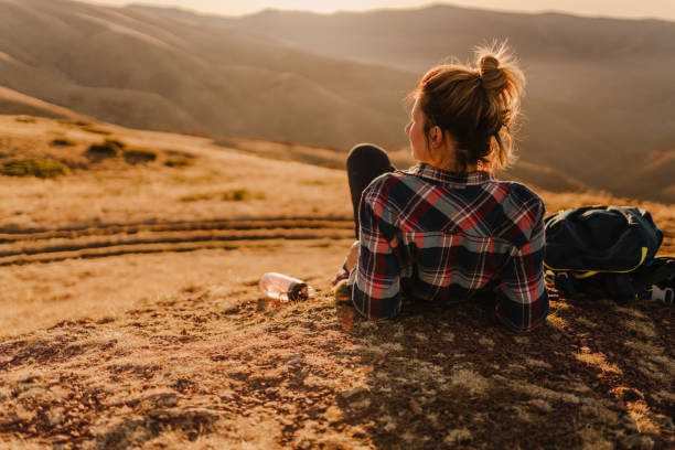 istock Lonely hiker resting on a mountain peak 1221311565