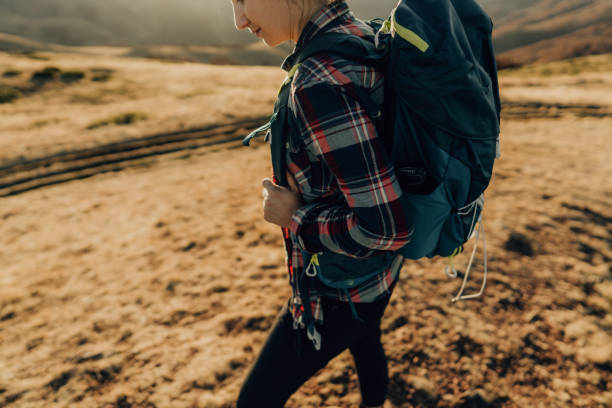 istock Woman hiking down the hill 1221311571