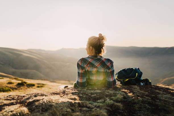 istock Lonely hiker resting on a mountain peak 1221311573