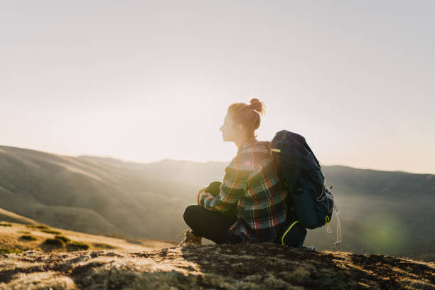 istock Lonely hiker resting on a mountain peak 1221311576