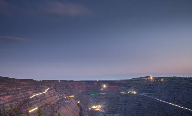 istock Iron ore quarry work in the evening or early morning 1221312421