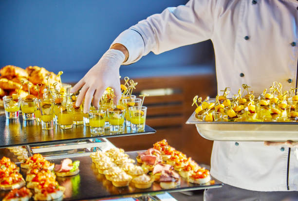 istock Hands of a cater 1221312789
