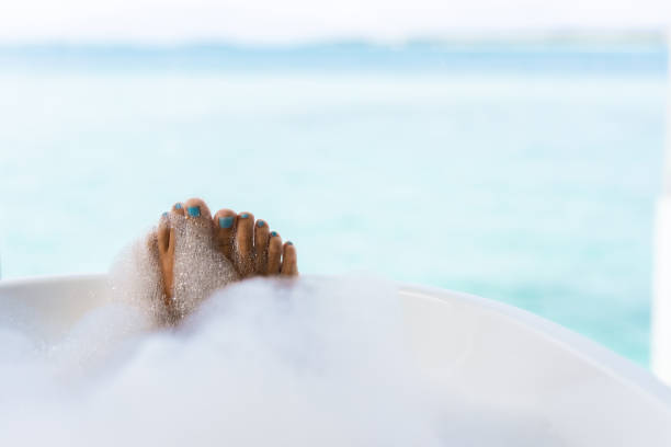 istock Close up of unrecognizable woman's feet in bubble bath. 1221313773