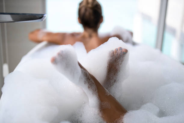 istock Unrecognizable woman's feet in bubble bath. 1221313961