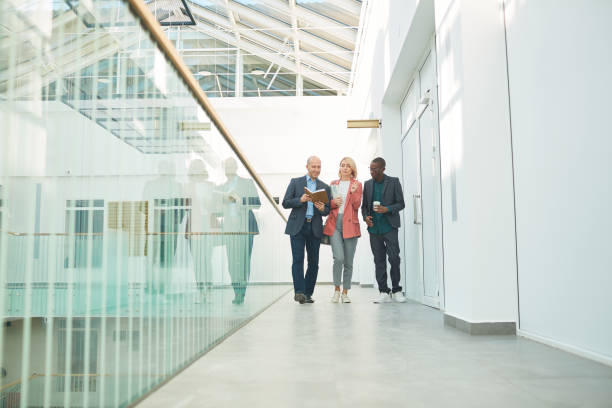 istock Business colleagues at office building 1221314058