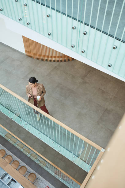 istock Businesswoman drinking coffee during break 1221314169