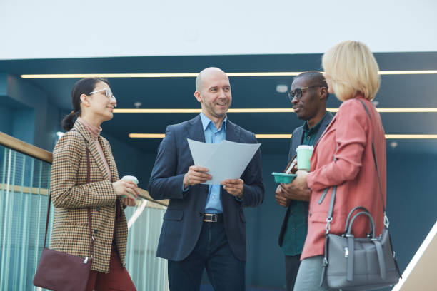 istock Businessman with report and his team 1221314185