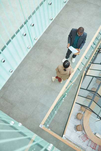 istock Young business people discussing report 1221314927