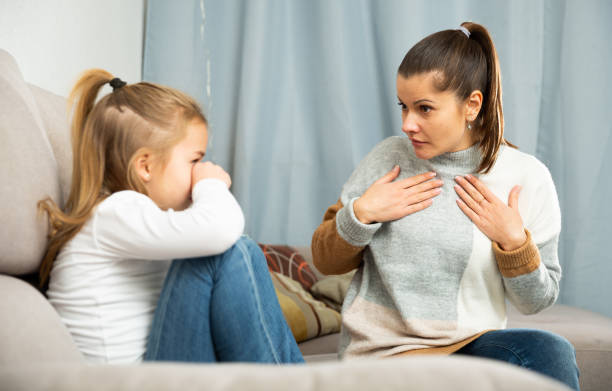 istock Woman having communication conflict with small daughter crying 1221316374
