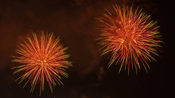 Close-up of real fireworks celebration and night skies background. stock photo