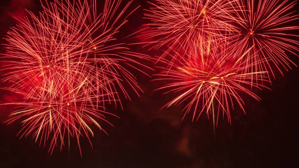 Close-up of real fireworks celebration and night skies background. stock photo