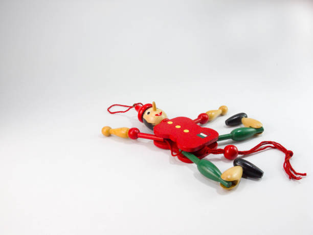 istock puppet Old wood Green and red puppet dolls On a white background. 1221320687