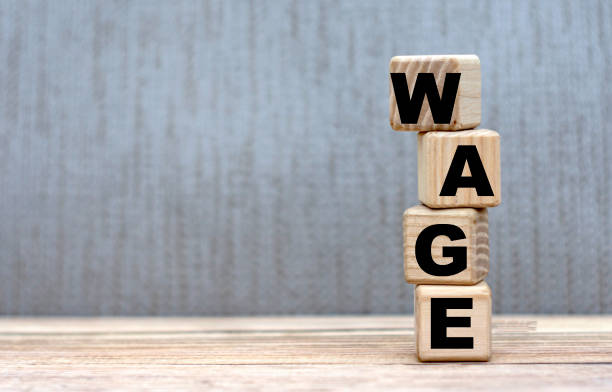 istock WAGE word on cubes on a beautiful gray background. 1221324865