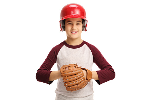 Boy wearing a baseball helmet and a glove isolated on white background