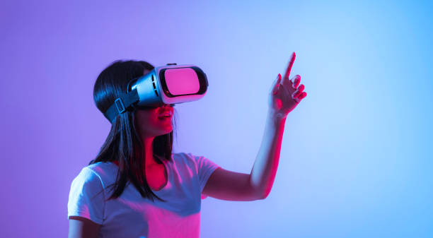 istock Modern technology concept. Girl in virtual reality glasses 1221327358