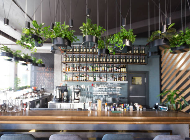 istock Blurred empty bar counter interior in stylish cozy cafe 1221327569