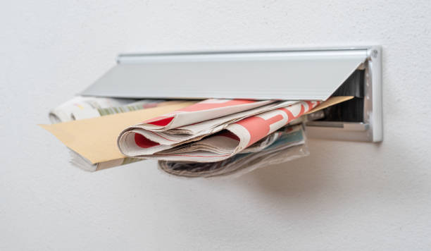 istock A letter and newspapers in a letterbox 1221327578