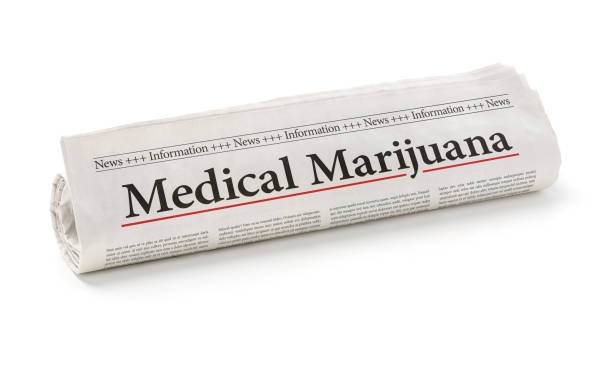 istock Rolled newspaper with the headline Medical marijuana 1221327662
