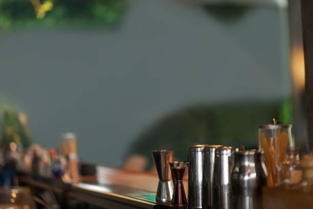 istock Close up view on wooden bar counter, blurred background 1221328943