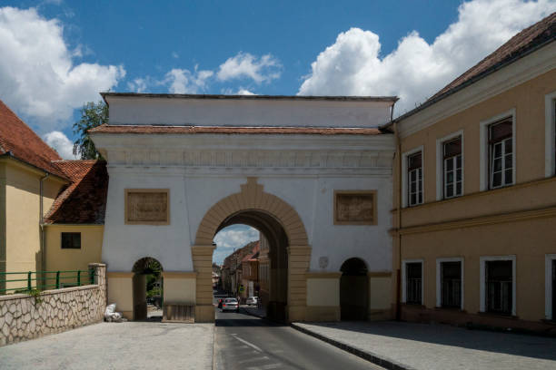 Schei gate in old city of Brasov, Transylvania, Romania; summer day Schei gate in old city of Brasov, Transylvania, Romania; summer day catherines gate stock pictures, royalty-free photos & images