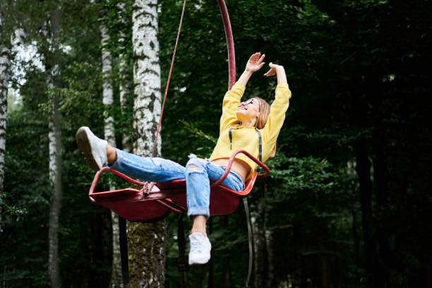 istock Young blond woman in amusement park 1221334789