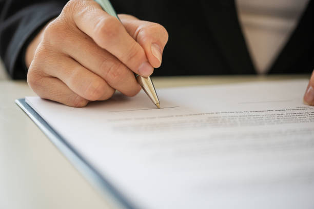 istock Closeup of signing a document 1221335618