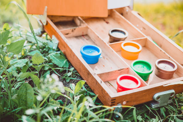 istock An easel with paints is lying on the grass 1221339325