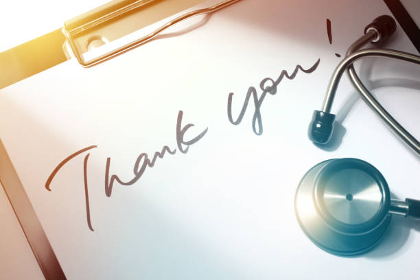 Word Thank You Written on Doctors Clipboard with Stethoscope Word Thank You Written on Doctors Clipboard with Stethoscope. professional thank you stock pictures, royalty-free photos & images
