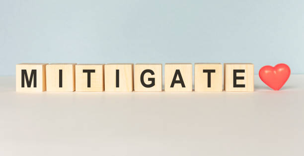 istock MITIGATE words from wooden blocks with letters, top view gray background 1221344297